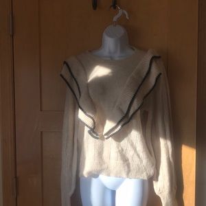 Tan and black ruffled knit